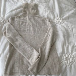 100% heather grey cashmere turtleneck sweater.